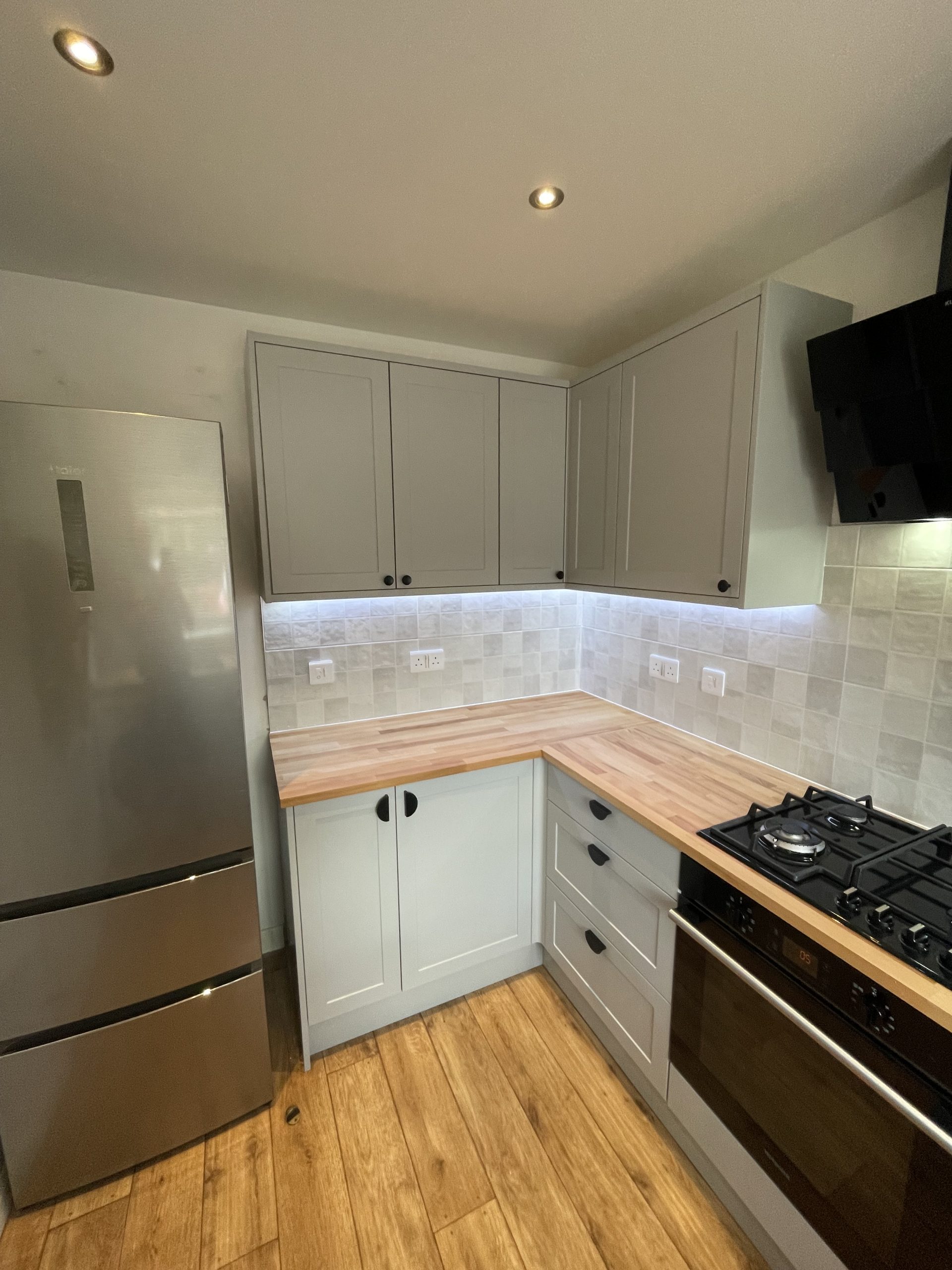 Kitchen renovation Reading with grey units and oak worktop