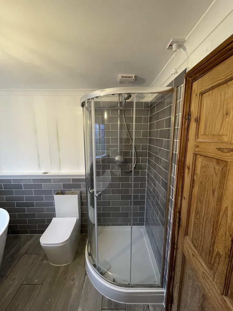 Bathroom with corner shower