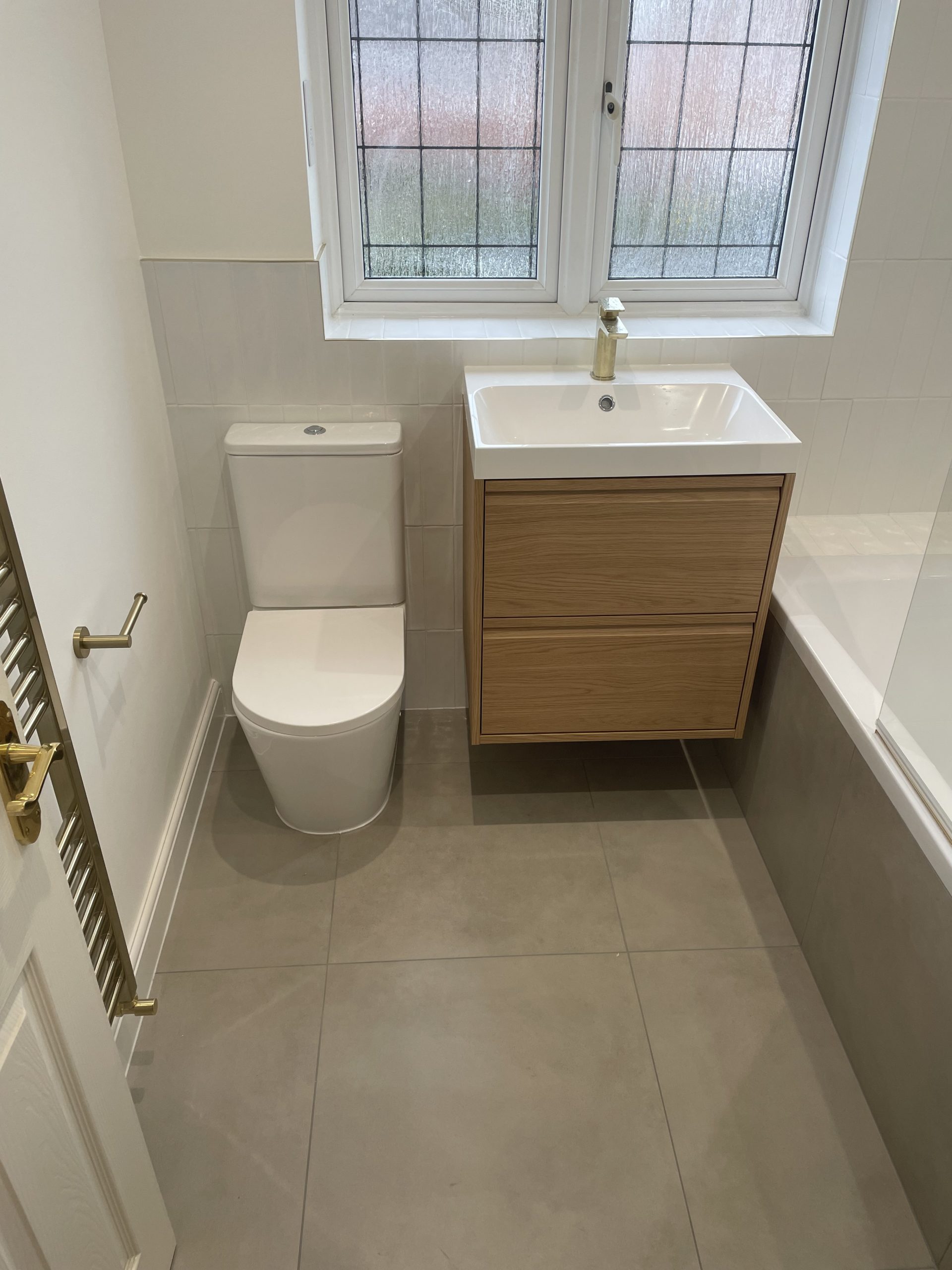 Modern bathroom fitting Reading with floating vanity and toilet